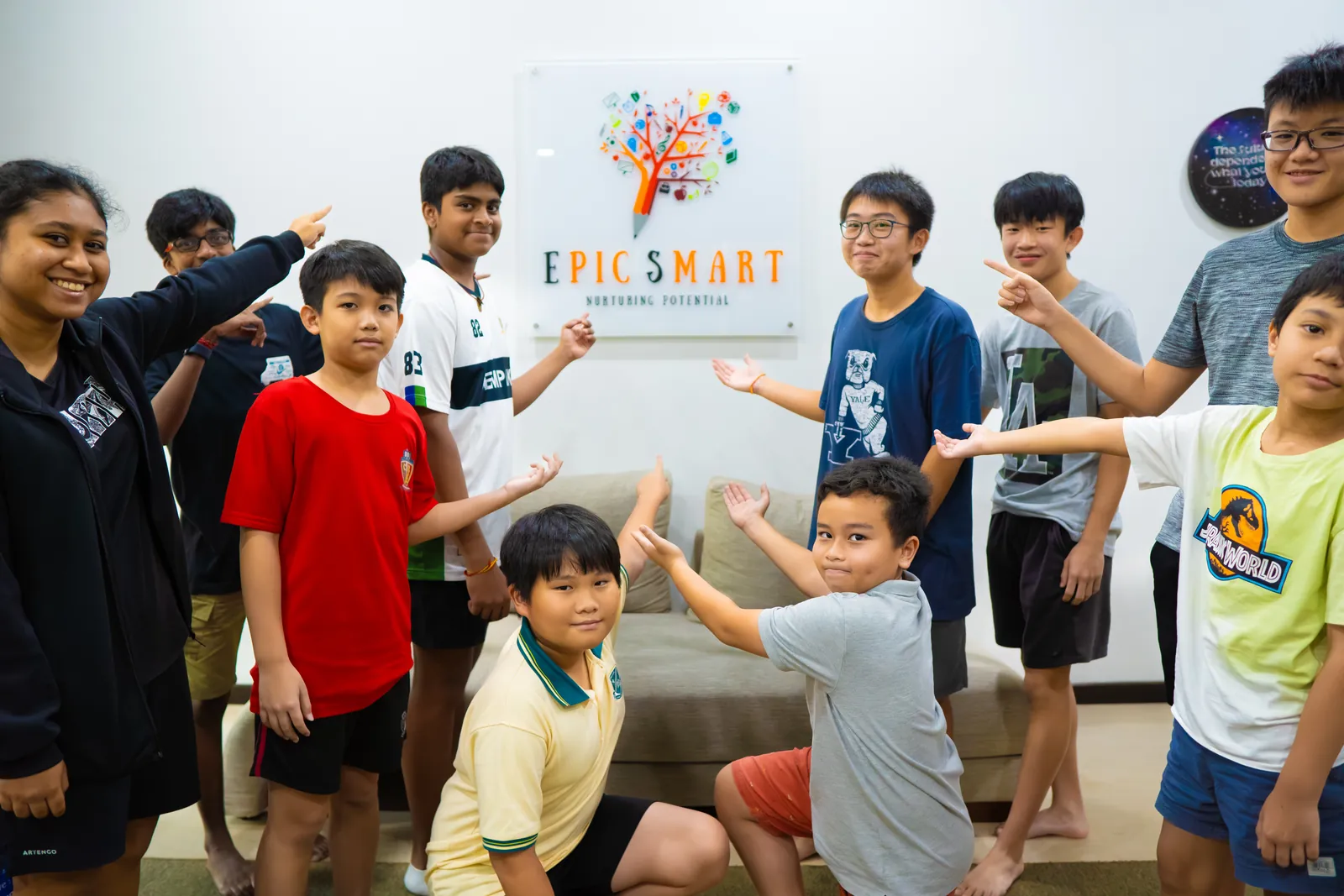 Students proudly presenting the Epic Smart Academy sign inside the Bangsar centre