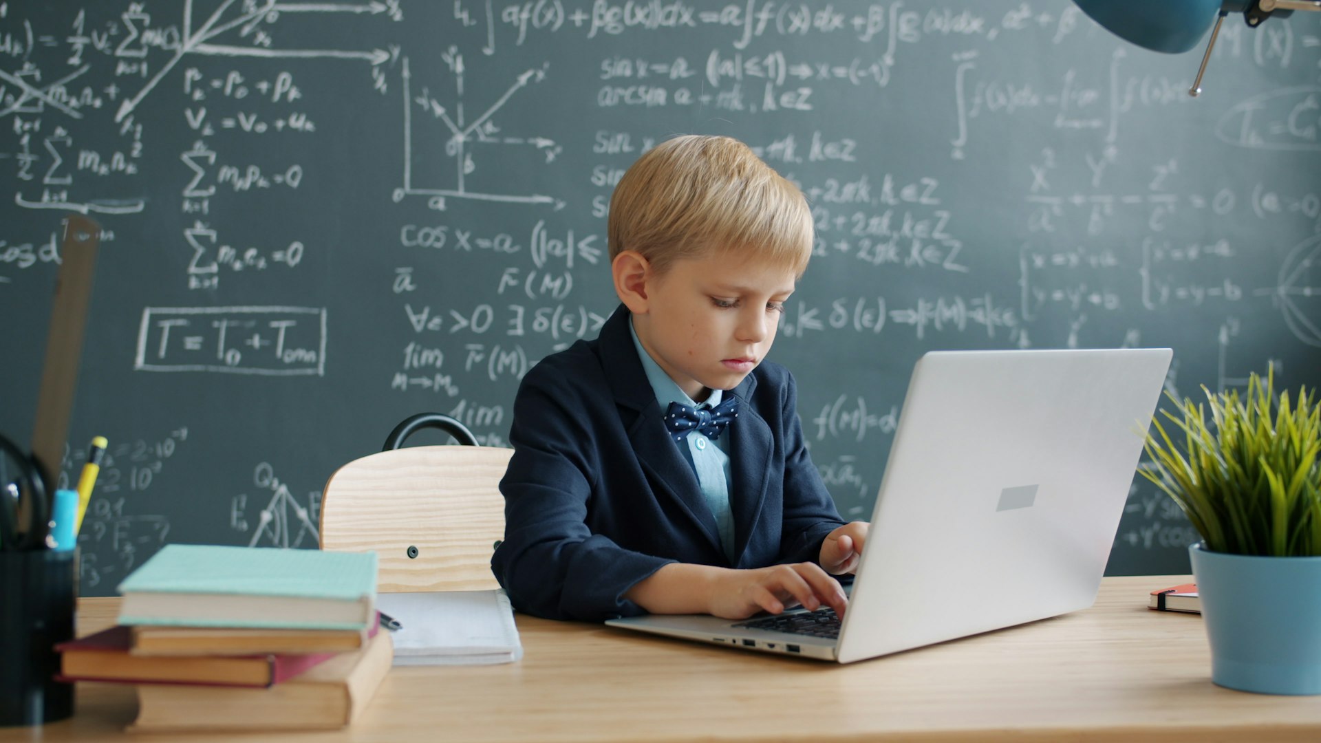 Add Maths practice questions being worked through at a study desk