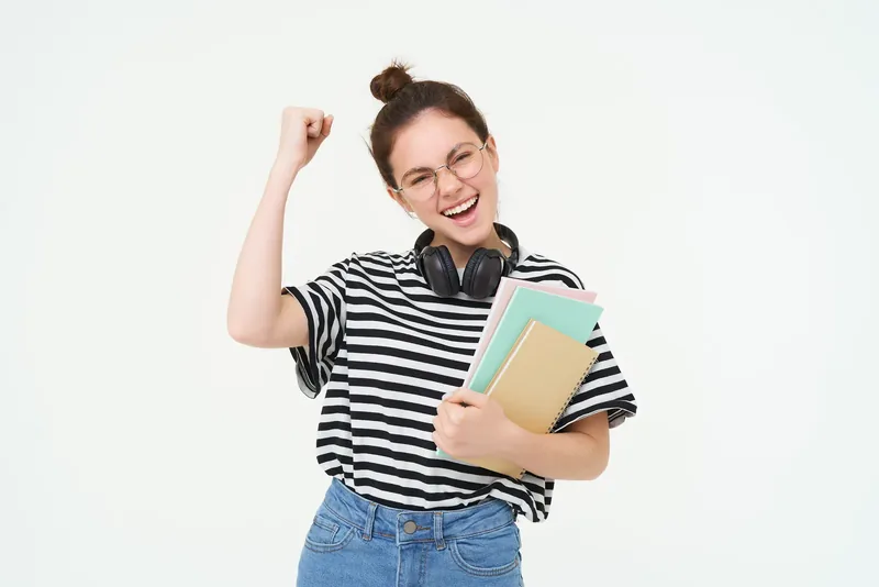 A confident student with her study books, ready for university-level challenges
