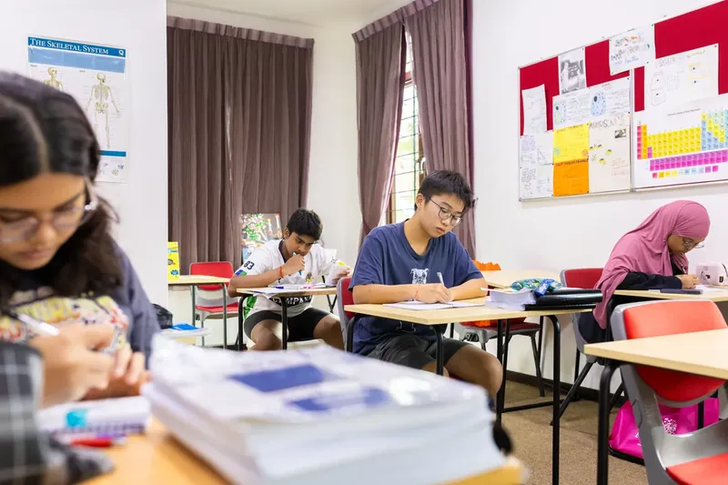 Students studying in a classroom with learning posters at Epic Smart Academy in Bangsar