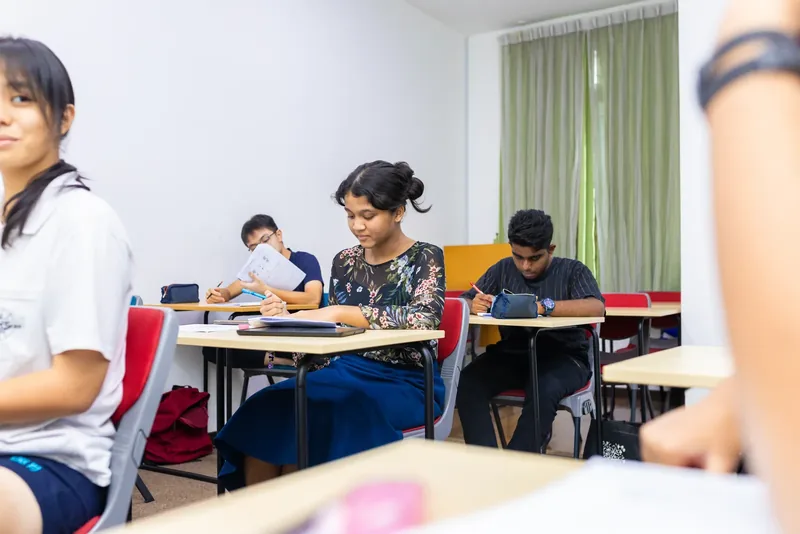 IGCSE students studying at their desks in a bright classroom at Epic Smart Academy in Bangsar