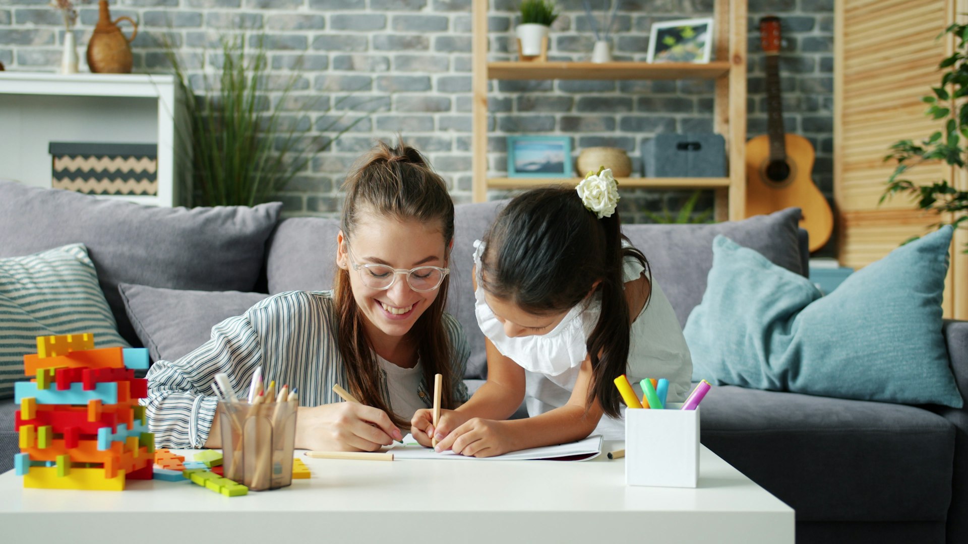 Parent and child working together at home during exam season