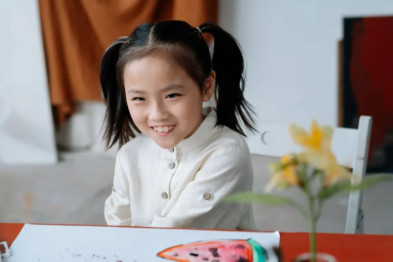 A young child learning phonics at Epic Smart Academy