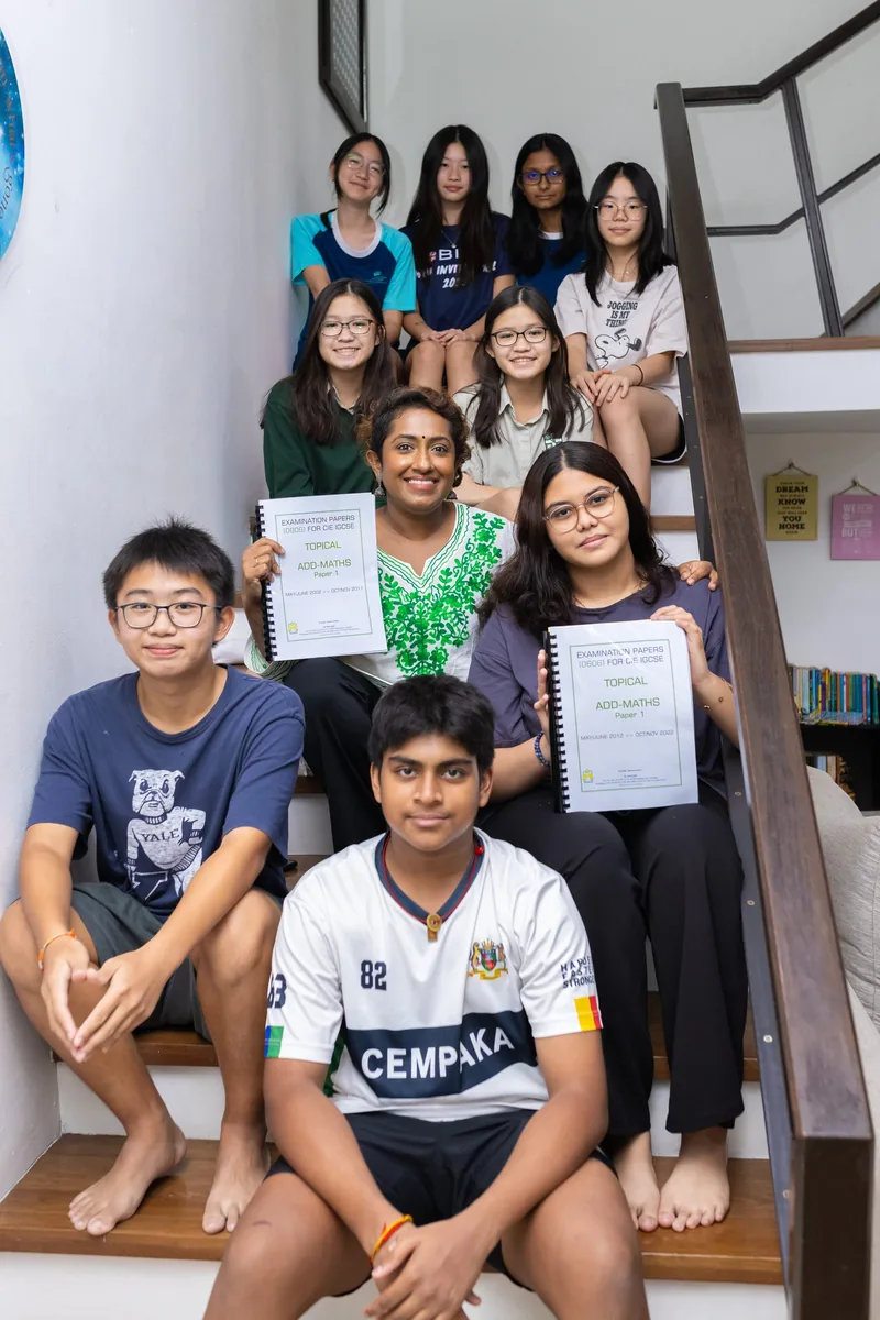 An Epic Smart Academy student proudly holding her IGCSE results