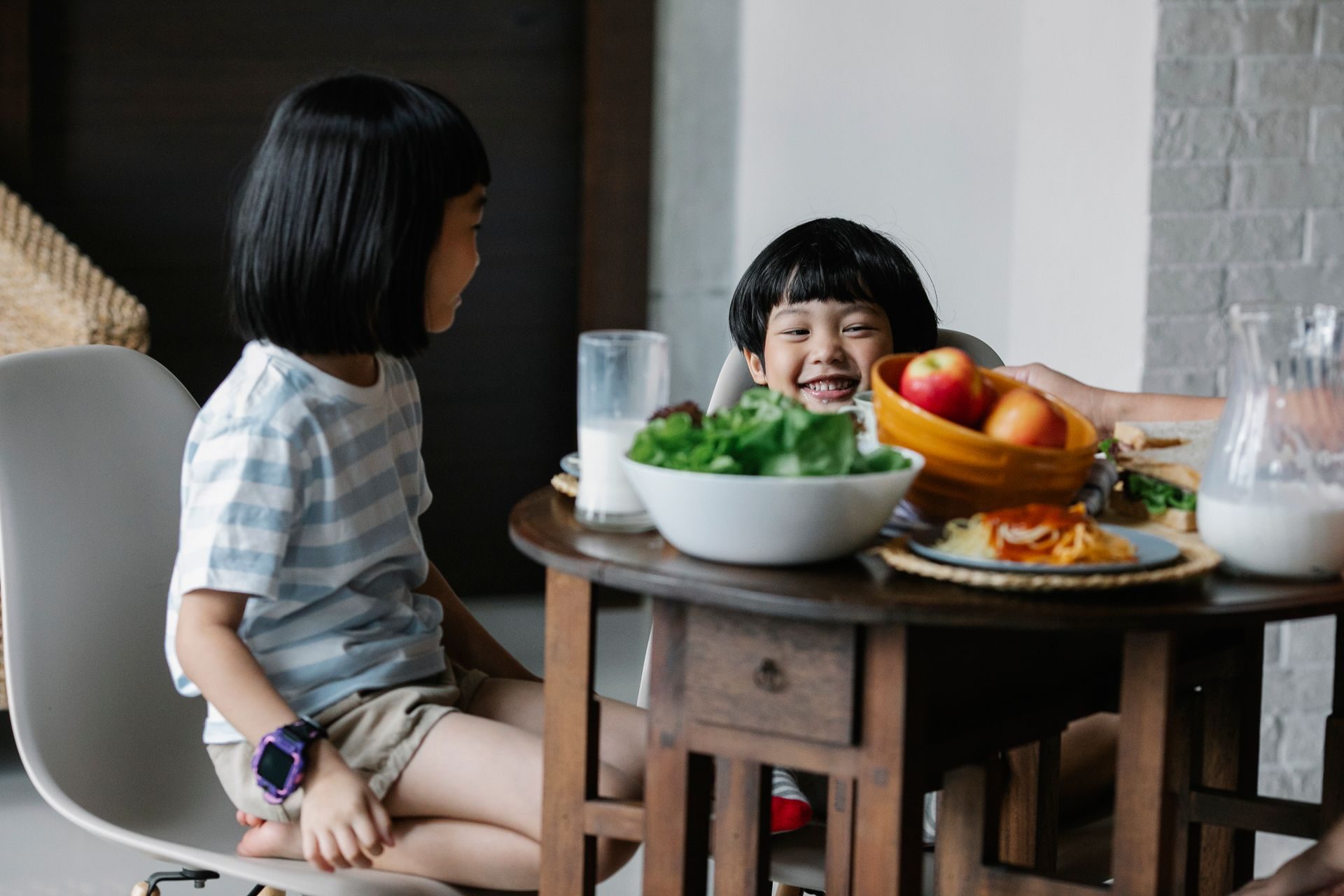 Young children working together at a table during an early learning session