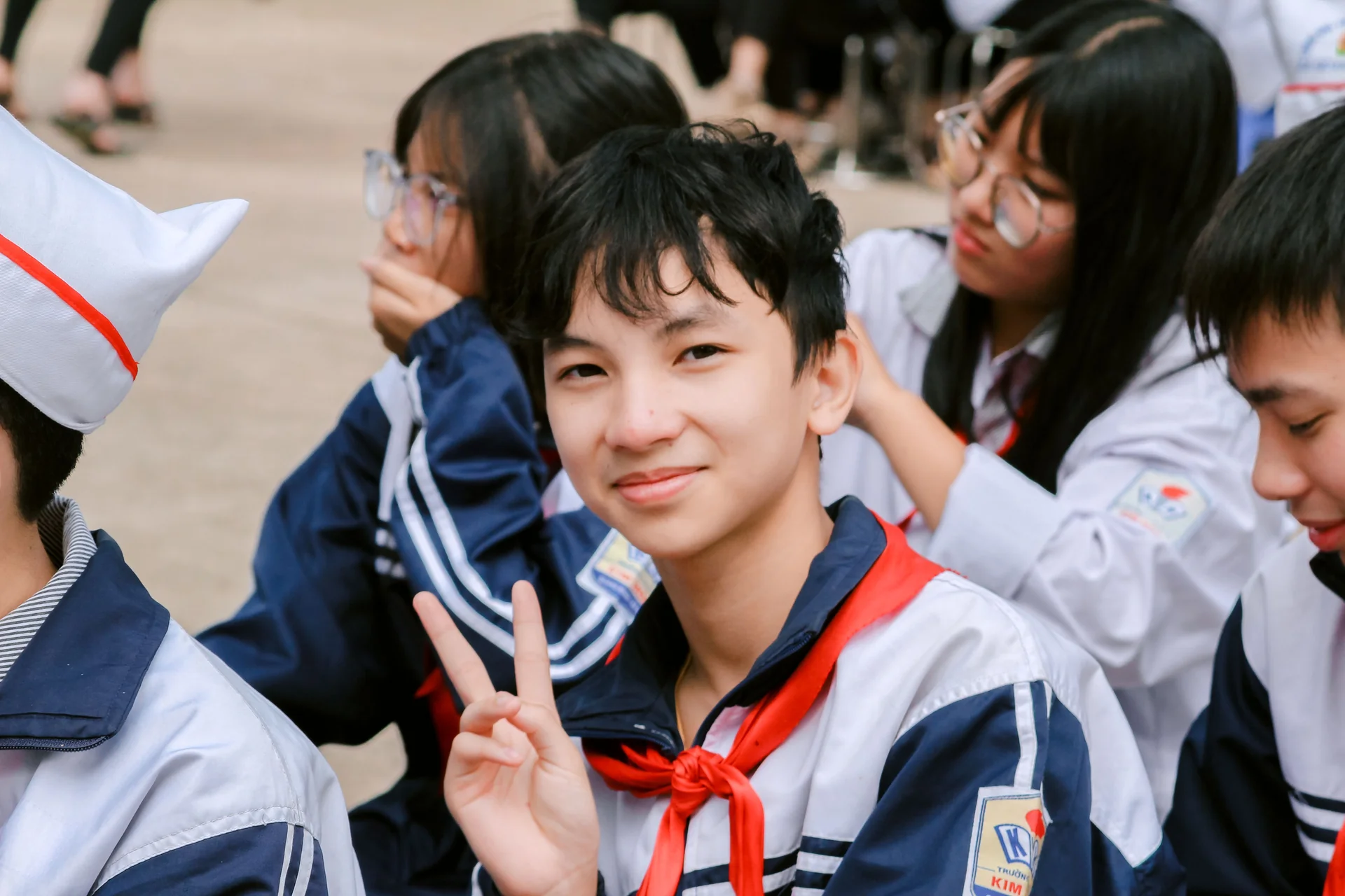 Group of secondary school students in uniform outdoors