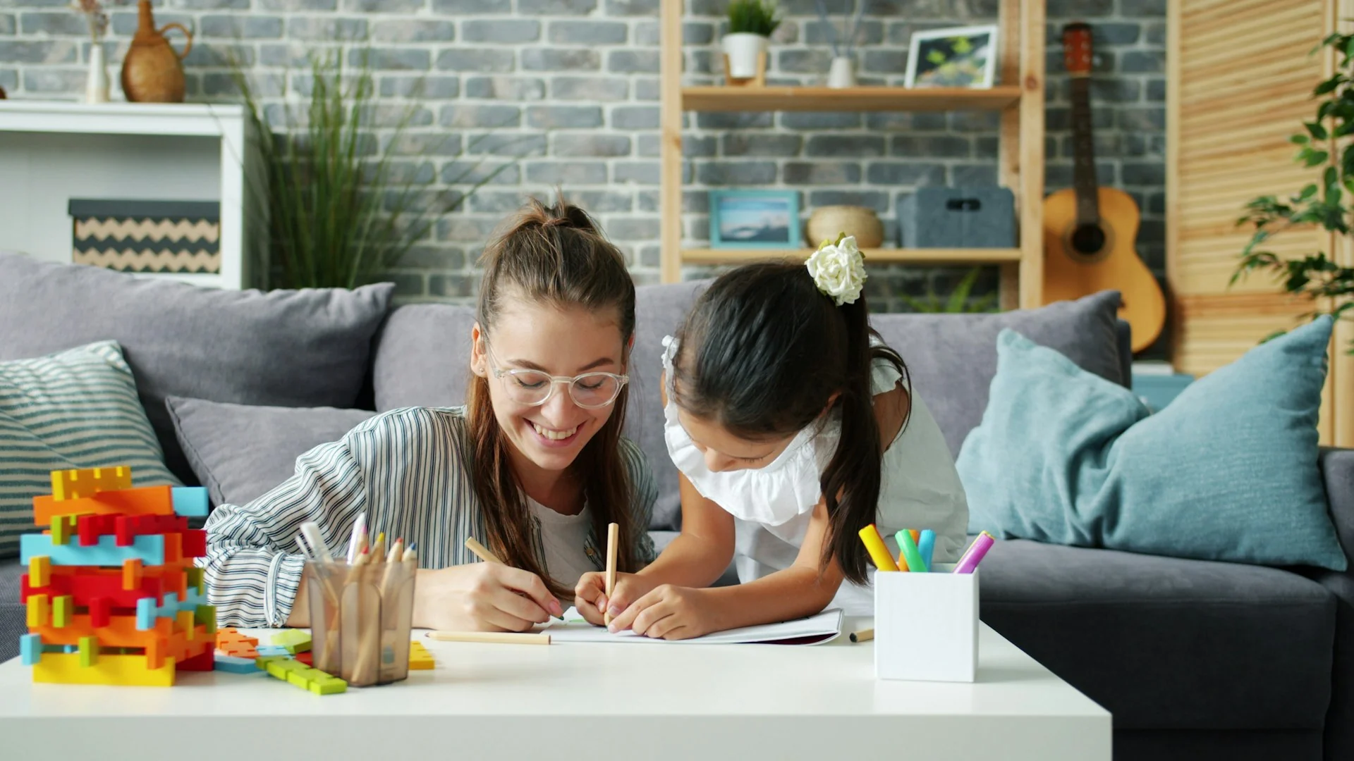 Parent and child working together at home during exam season