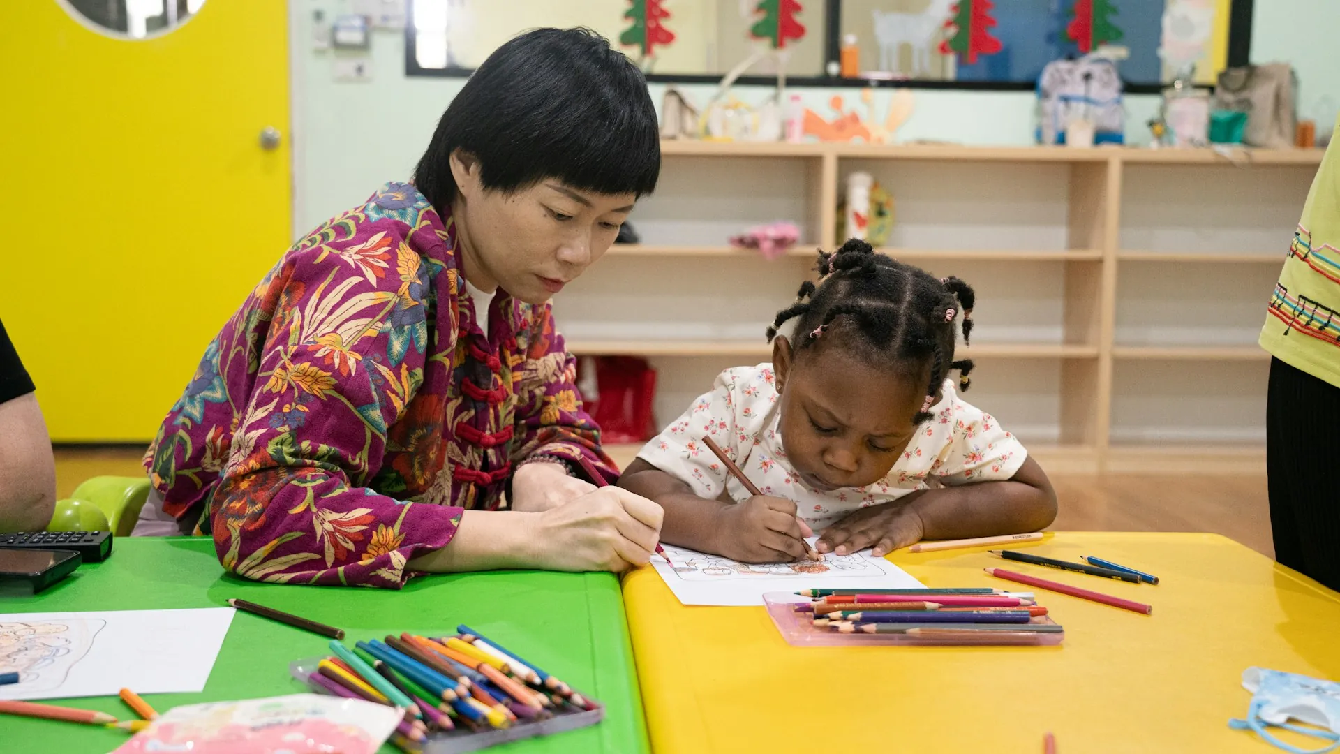 Teacher working one to one with a child who needs learning support